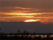 Sonnenuntergang ber dem Achterwasser: Das Loddiner Hft auf Usedom.