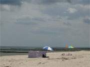 Die letzten Badegste: Vor dem Gewitter am Strand.