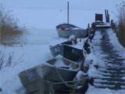 Winterimpressionen von der Insel Usedom: Fischerboote im Eis.