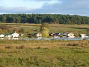 Hinterland der Insel Usedom: Bootshuser am Nepperminer See.