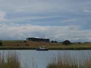 Wolken ber der Halbinsel Loddiner Hft: Boot auf der Melle.