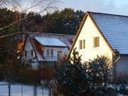 Abendsonne: Die Steinbock-Ferienwohnungen im Winter.