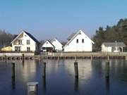 Inselmitte von Usedom: Ferienhuser am Hafen Stagnie.