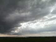 Regenwolken ber dem Achterwasser: Loddin auf Usedom.